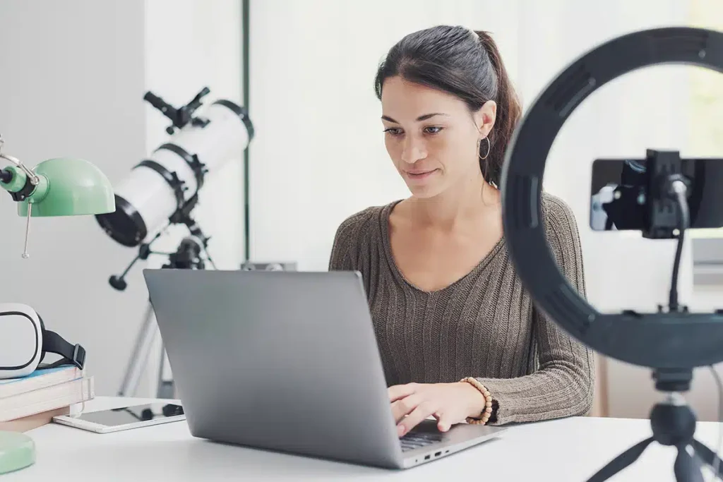 Woman working at her desk, illustrating membership, online course, and subscription business models
