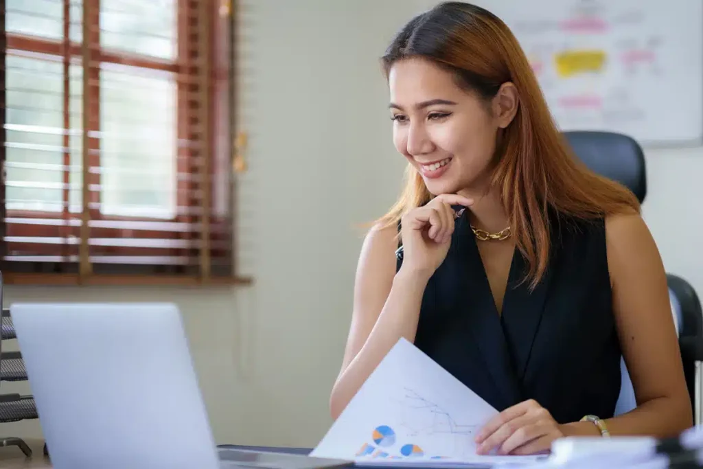 Smiling dietitian looking at her business plan